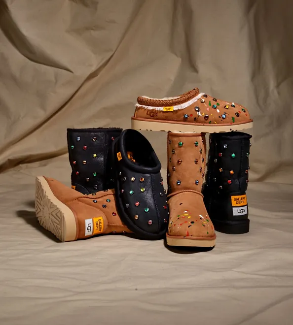 The UGG Gallery Dept collection with a brown curtain background. 