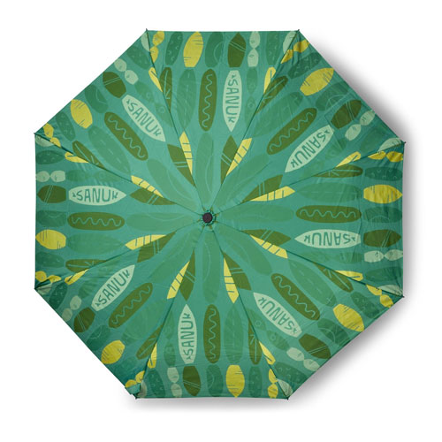 Umbrella viewed from above, with green and yellow patterns containing the word Sanuk.